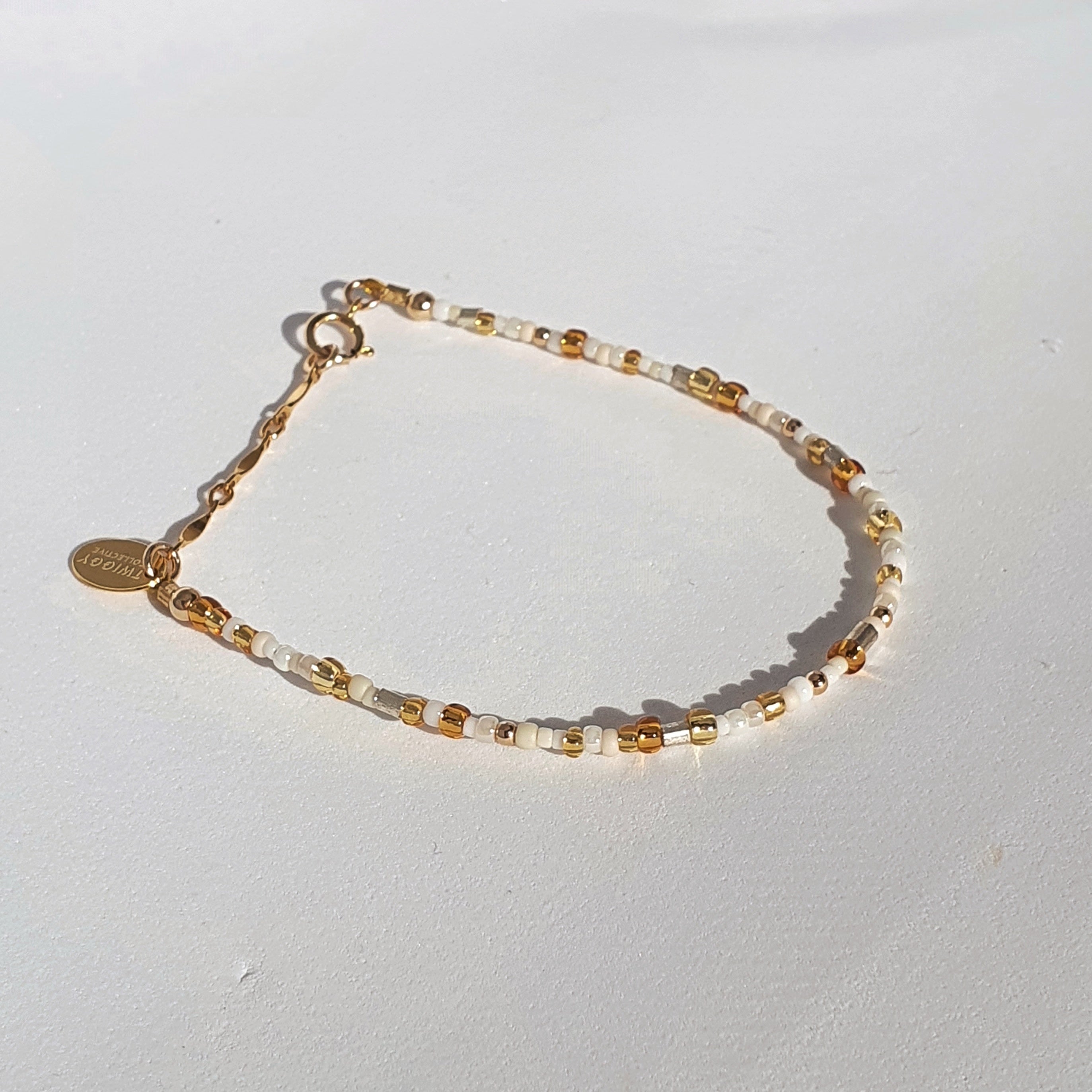 A minimal design featuring glass seed beads, galvanised metal beads and 14Kt gold-filled beads. A mismatched, imperfect design created to compliment any bracelet stack.