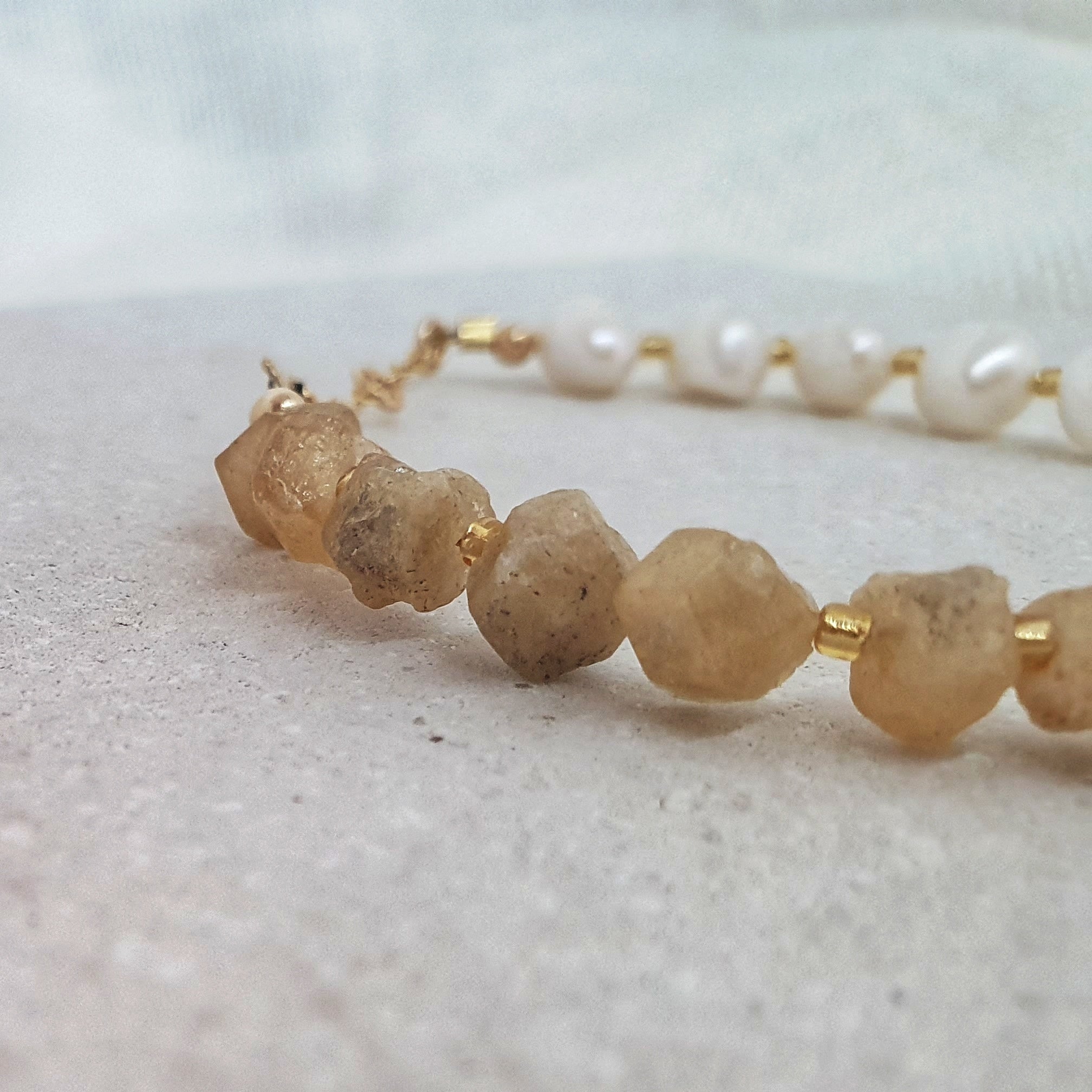 Designed with freshwater pearls, yellow garnet chips, glass seed beads and 14Kt gold-filled beads. The centrepiece to our first collection, Bossy is a chunkier statement piece yet still maintains a delicate feminine feel.