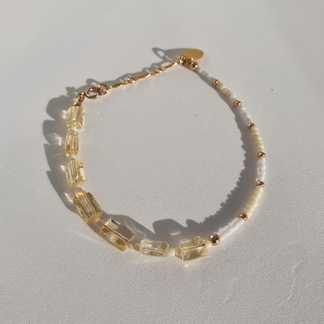 Designed with citrine, glass seed beads and 14Kt gold-filled beads. Lover is a unique asymmetrical design featuring citrine - just watch the light sparkle through this gorgeous stone!